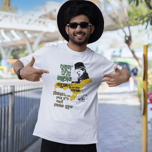 Person wearing a white t-shirt with a graphic design, standing outdoors with a blurred background